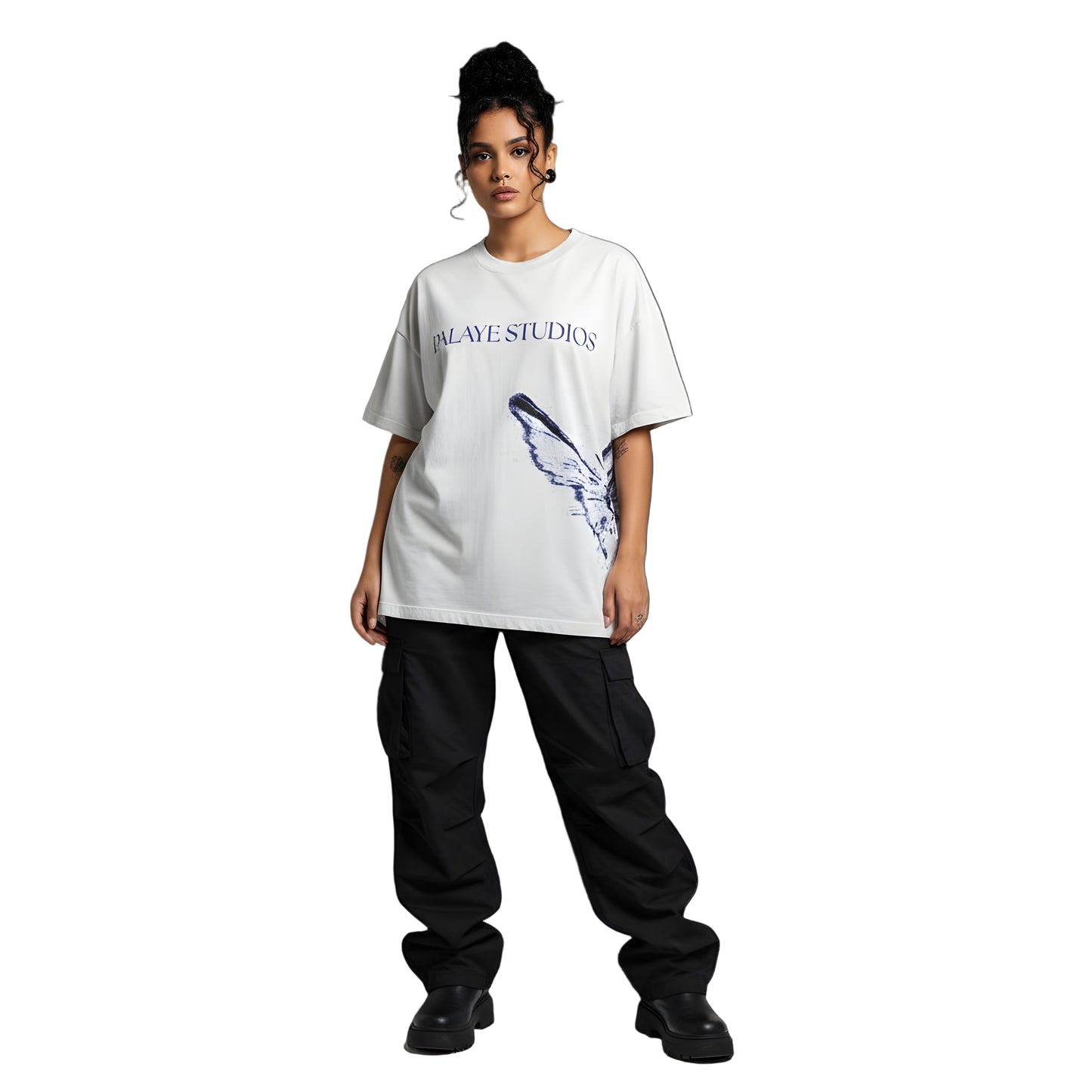 Person wearing a white t-shirt with a graphic design and text, standing against a plain background