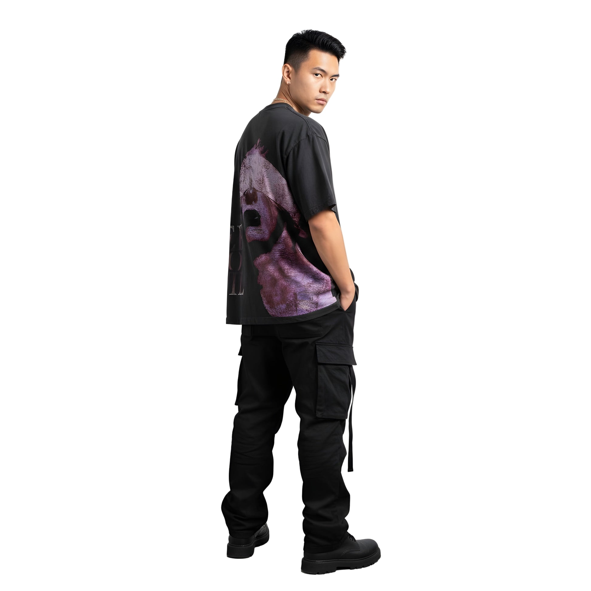 Man wearing a black and purple tie-dye shirt with black cargo pants on a white background