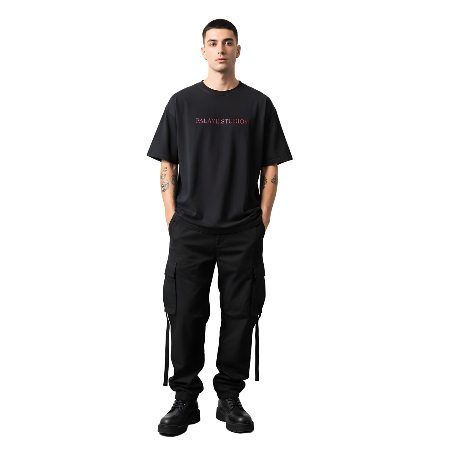 Person wearing a black t-shirt with 'Palace Studios' logo and black pants on a white background