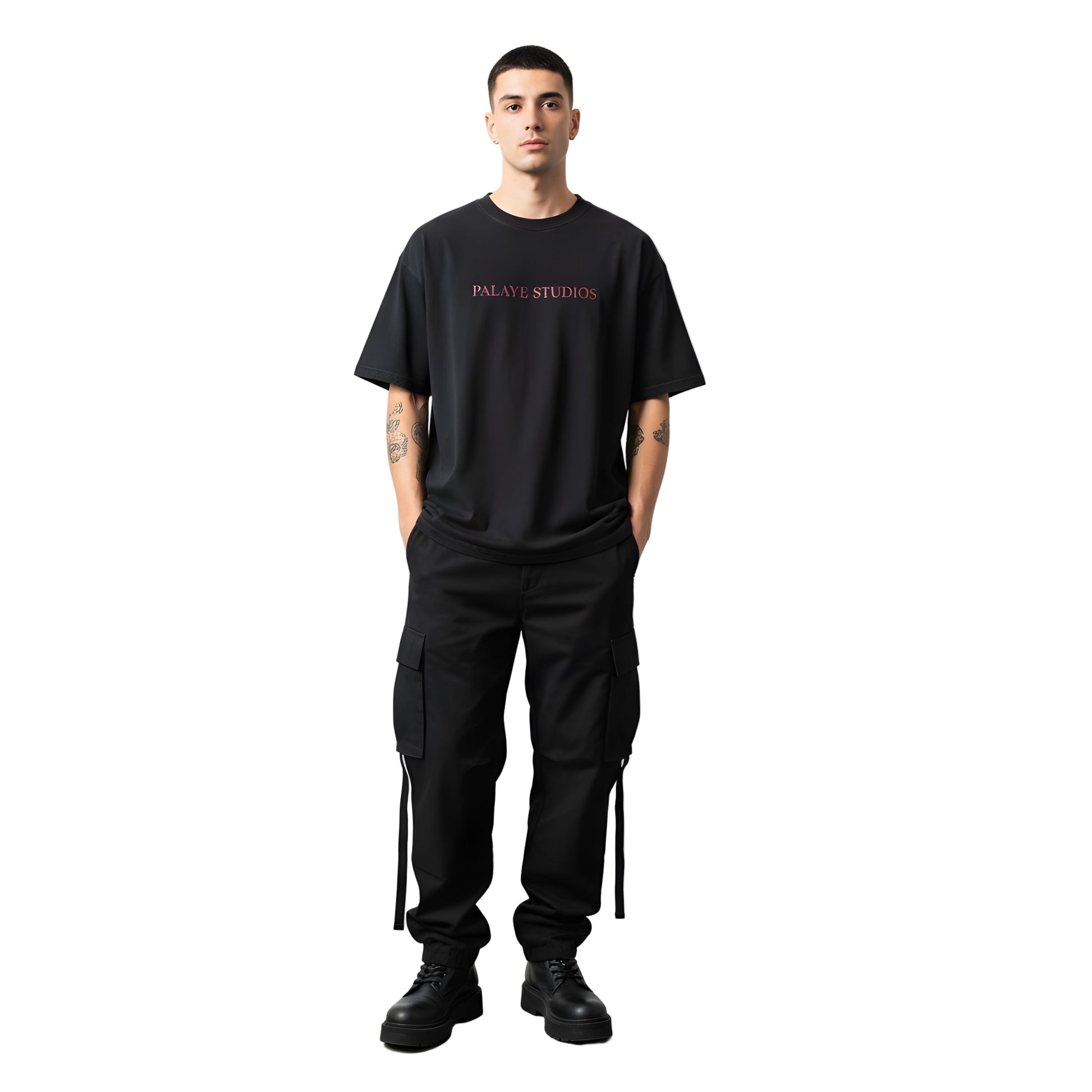 Person wearing a black t-shirt with 'Palace Studios' logo and black pants on a white background